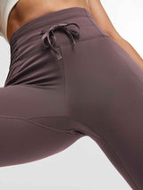 Running High-Waisted Fleece Leggings in mauve with drawstring detail. #color_Dark Brown
