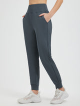 Women's dark grey fleece-lined running joggers with high waist and cuffed ankles. #color_Charcoal Gray