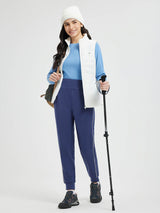 Flat waist fleece-lined running joggers in blue with white side stripe, on model. #color_Blue/White