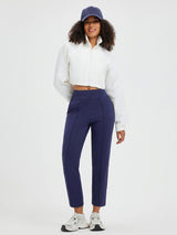 Model wearing navy Tapered Running Pouch Pockets Pants #color_Navy Blue