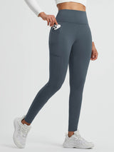 Slate grey running leggings with fleece, cross pocket holding smartphone. #color_Charcoal Gray