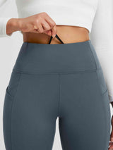 Blue-grey fleece running tights with high waist and deep cross pockets. #color_Charcoal Gray