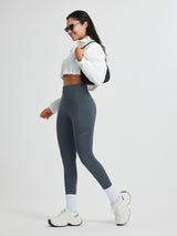 High-waisted charcoal grey fleece running leggings with cross pockets & reflective dots.