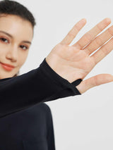 Black long-sleeve running top with thumbhole cuff. #color_Black