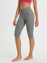 Gray women's 14-inch high-waisted crossover capris with two side pockets and a v-shaped waistband. #color_Dark Gray
