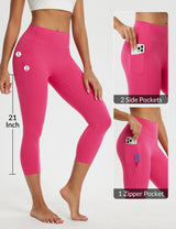 Women's pink 21-inch high-waisted capri leggings with 2 side pockets and 1 zipper pocket.