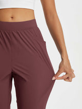 Dynamic Form high-rise tapered trousers in maroon, showcasing stretch fabric. #color_Burgundy