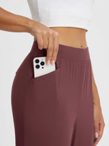 Maroon high-rise tapered trousers with phone pocket, part of casual sun protection set. #color_Burgundy
