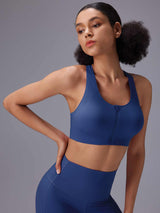 Women's blue front zip sports bra and high-rise Bermuda shorts set. #color_Blue