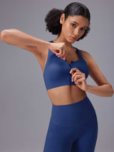 Blue zip-front sports bra from the All-Day Active Essentials set. #color_Blue