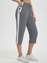 Women's gray 19" quick-dry yoga capri pants with white side stripe and phone pocket #color_Dark Gray
