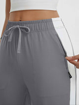 Gray women's 19" quick-dry yoga capri pants with drawstring and zippered pocket. #color_Dark Gray