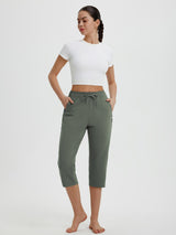 Olive green women's 19" quick-dry yoga capri pants with drawstring and zippered pocket. #color_Army Green