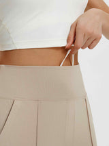 Woman's beige Bermuda shorts with a white drawstring and elastic waistband. #color_Khaki