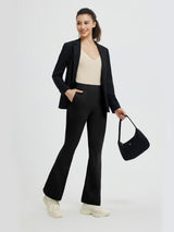 Women's black high-waisted flared yoga business pants styled with blazer. #Color_Black
