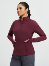 Women's burgundy half-snap long-sleeve yoga top with thumbholes and pockets. #color_Wine Red