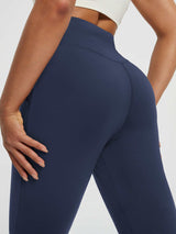 Navy blue women's fleece yoga leggings with high waist and side pocket detail. #color_Navy Blue
