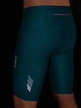 Teal Baleaf 4D padded bike shorts with 10" inseam, zippered back pocket, and reflective accents. #color_Teal Green