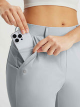 Baleaf women's 25" golf pants in light grey, hand shows phone pocket feature. #color_Light Gray