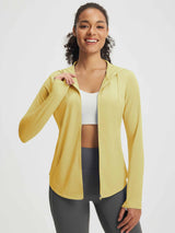 Model wearing yellow textured lightweight hooded UPF 50+ sun jacket for sport leisure set. #color_Yellow