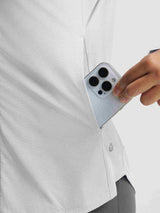 White Baleaf UPF 50+ lightweight sun jacket with textured fabric and secure side pocket holding phone. #color_Light Gray