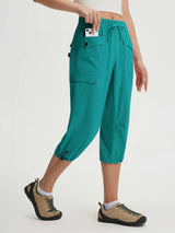 Teal Baleaf lightweight 19-inch cargo capri pants for women, 7 pockets, adjustable ankles.