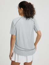 Baleaf UPF 50+ sun protection shirt, women's grey short sleeve, back view, curved hem. #color_Light Gray