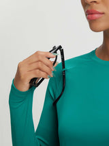 Teal Baleaf UPF 50+ long-sleeve crop sun shirt with integrated eyewear loop. #color_Teal Green
