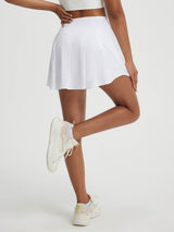 White Baleaf high-rise 14-inch pleated tennis skirt with A-line cut #color_White