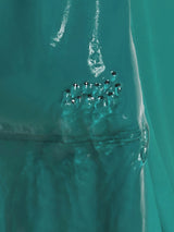 Teal Baleaf UPF 50+ 11" board shorts detail with drainage grommets. #color_Teal Green