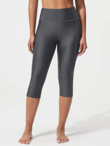 UPF50+ 18 inch high rise swim capris in charcoal with side pockets and tummy control. #color_Dark Gray