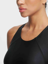 Black one-piece racerback swimsuit showing neckline and strap detail #color_Black
