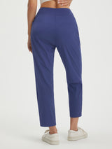 Navy blue petite 25-inch ankle length pull on travel pants with faux fly and pockets #color_Navy Blue