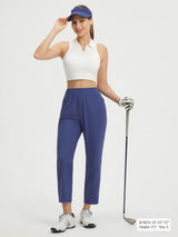 Petite blue ankle length pull on travel pants worn by model in golf attire. #color_Navy Blue