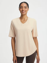 Baleaf beige UPF 50+ V-neck athletic shirt with breathable fabric, half sleeves, and curved hem. #color_Beige