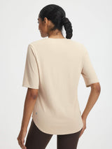 Baleaf women's beige athletic shirt, moisture-wicking fabric, half sleeves, curved hem, UPF 50+ #color_Beige