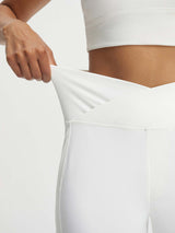 Baleaf white V-waist 9" Bermuda long shorts showing ultra-soft stretch fabric #color_White