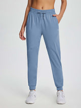 Women's blue drawstring fleece jogger pants featuring elastic waistband and side pockets. #color_Light Blue