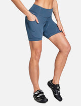 Blue women's V-waist cycling shorts with utility side pockets and padded gusset. #color_Navy Blue