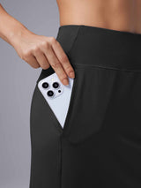 Black Laureate UPF50+ knee-length skort with phone in side pocket. #color_Black