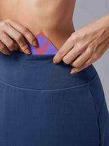 Blue Laureate UPF50+ knee-length skort with hidden waistband pocket detail. #color_ Peacoat