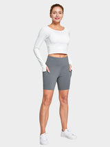 Grey women's 6" high-waisted biker shorts with deep side pockets. #color_Cement Gray