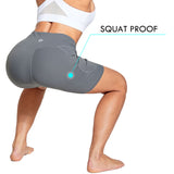 Grey women's high-waisted biker shorts with side pockets, labeled 'Squat Proof'. #color_Cement Gray