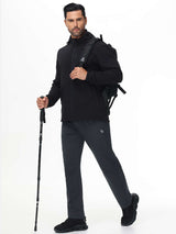 Men's water-resistant fleece-lined straight leg pants worn for outdoor activity. #color_Dark Gray