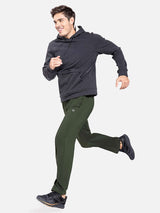 Man jogging in army green Baleaf fleece lined thermal pants and charcoal hoodie