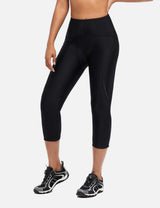 Women's black UPF 50+ padded cycling capris, high-waisted with reflective details.