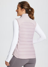 Running slim-fit puffer vest, light pink, quilted with reflective details.