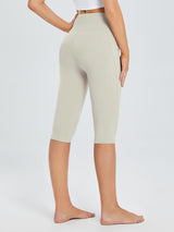 Laureate women's cream high-waisted pocketed yoga capris with 4-way stretch fabric. #color_Light Brown