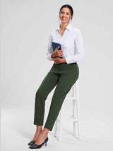Woman in green tapered jogger pants and white shirt, holding a tablet. #color_Army Green