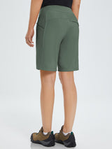 Women's green 9" quick-dry hiking Bermuda shorts with zippered pockets and athletic shoes. #color_Army Green